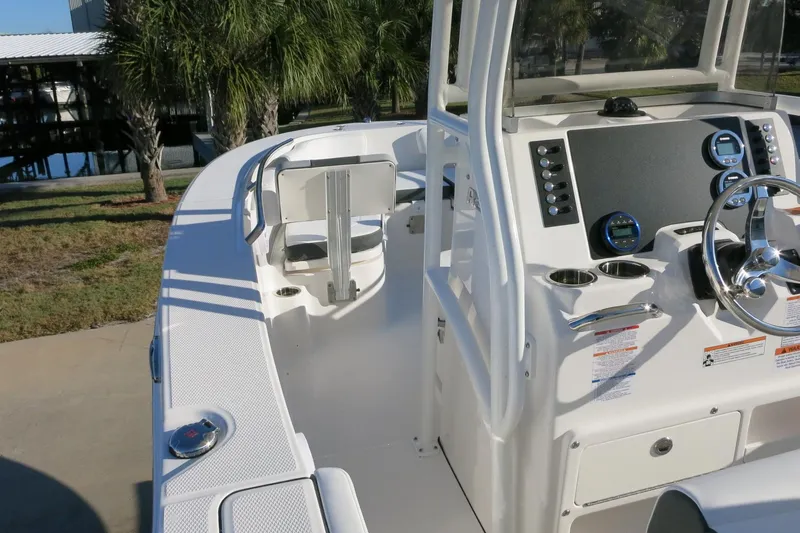 Slide: The Image of 2026 Robalo R200 Center Console boat interior with steering wheel and control panel. - 14