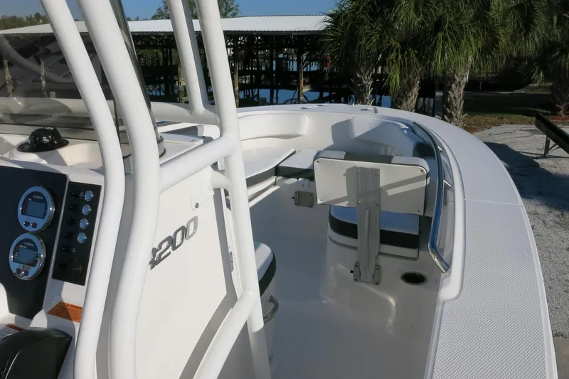 Slide: The Image of 2026 Robalo R200 Center Console boat with sleek design and modern dashboard. - 15