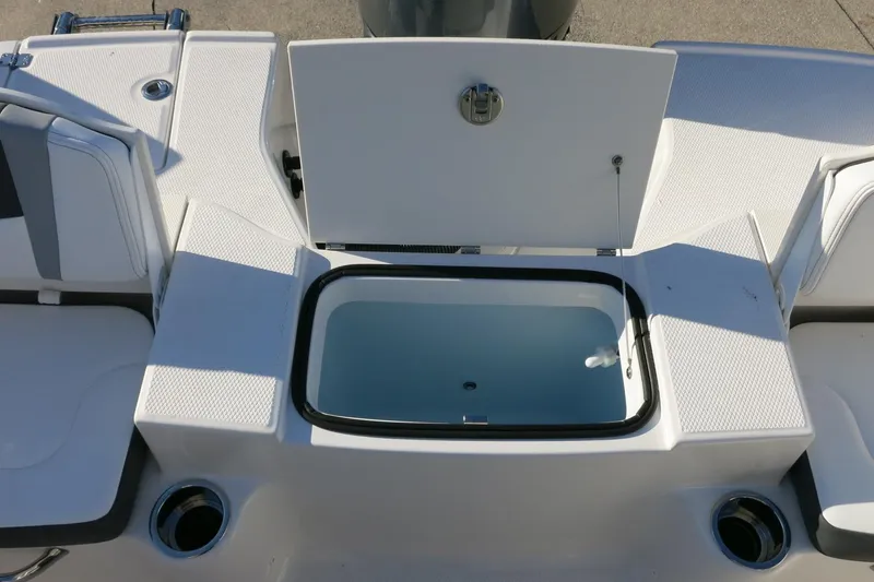 Slide: The Image of 2026 Robalo R200 Center Console boat with open storage compartment and seating. - 19