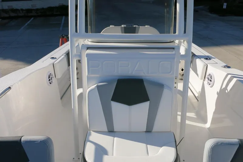 Slide: The Image of 2026 Robalo R200 Center Console boat interior with seating and console view. - 23
