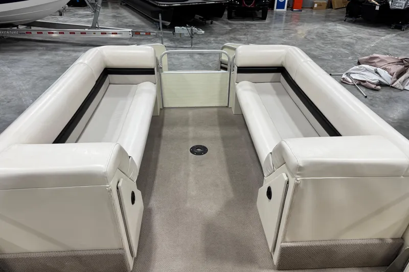 Slide: The Image of Interior of a 2002 Voyager Extreme 25 Cruise boat with white seating. - 14