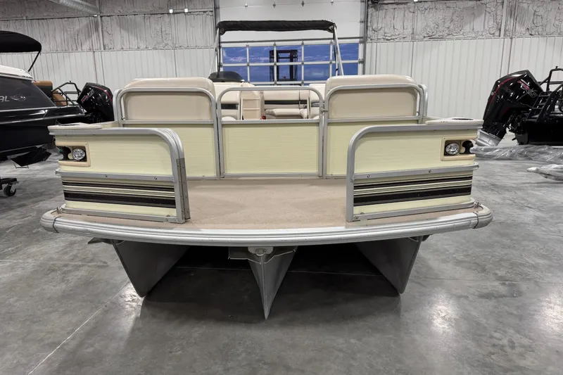 Slide: The Image of 2002 Voyager Extreme 25 Cruise pontoon boat in a warehouse setting. - 7