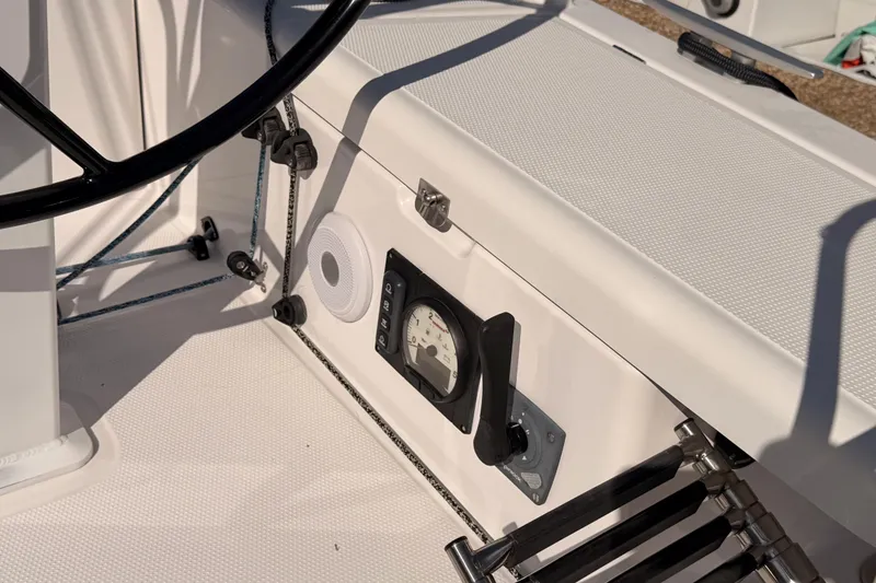 Slide: The Image of Cockpit of 2023 Beneteau First 36 sailboat with steering wheel and control panel. - 15