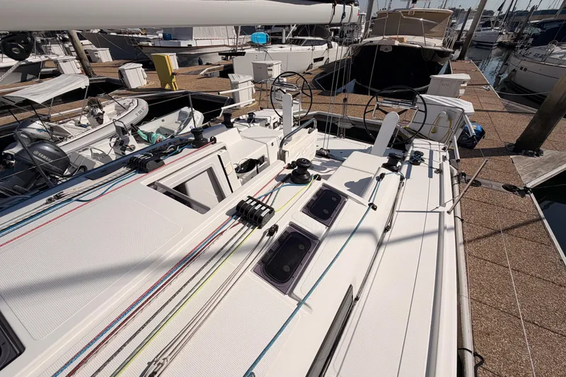 Slide: The Image of 2023 Beneteau First 36 sailboat docked, showcasing deck and rigging details. - 38