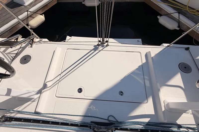 Slide: The Image of 2023 Beneteau First 36 yacht deck with ropes and fittings in sunlight. - 40
