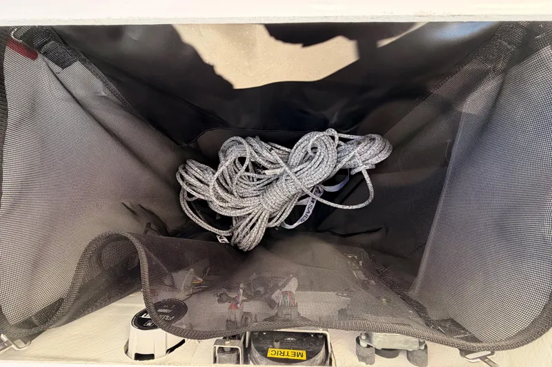 Slide: The Image of Storage compartment with rope in 2023 Beneteau First 36 sailboat. - 43