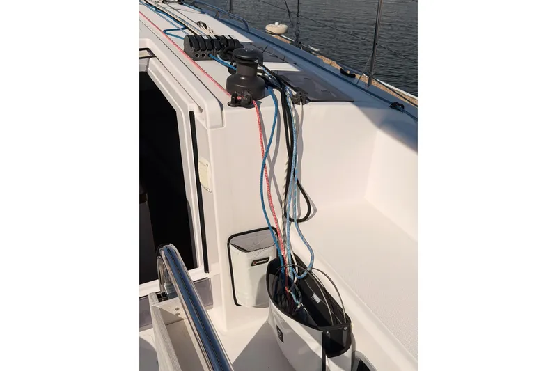 Slide: The Image of 2023 Beneteau First 36 sailboat deck with ropes and winch system. - 49