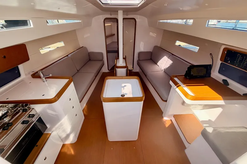 Slide: The Image of Interior of 2023 Beneteau First 36 yacht, featuring modern design and spacious seating. - 52