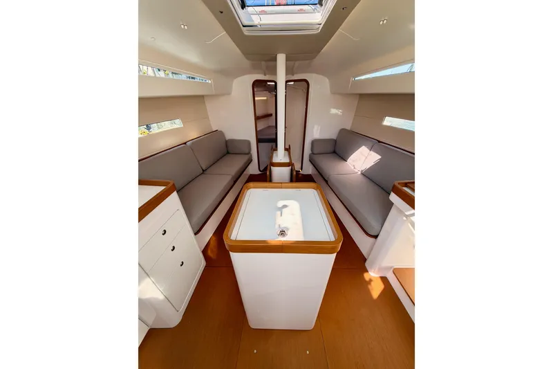 Slide: The Image of Interior of 2023 Beneteau First 36 sailboat, featuring modern seating and sleek design. - 55