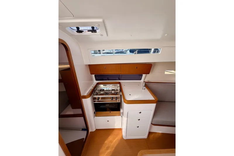 Slide: The Image of 2023 Beneteau First 36 yacht interior with modern kitchen and seating area. - 59