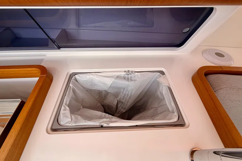 Slide: The Image of Trash bin in the galley of a 2023 Beneteau First 36 sailboat. - 61