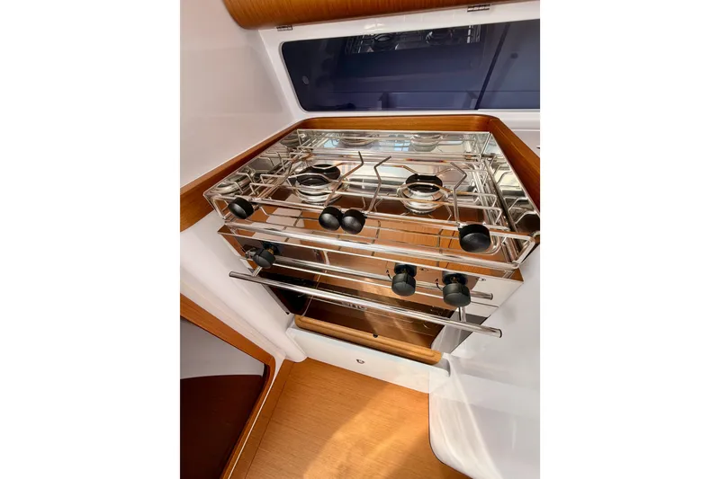 Slide: The Image of Modern kitchen area in 2023 Beneteau First 36 yacht with stainless steel stove. - 62