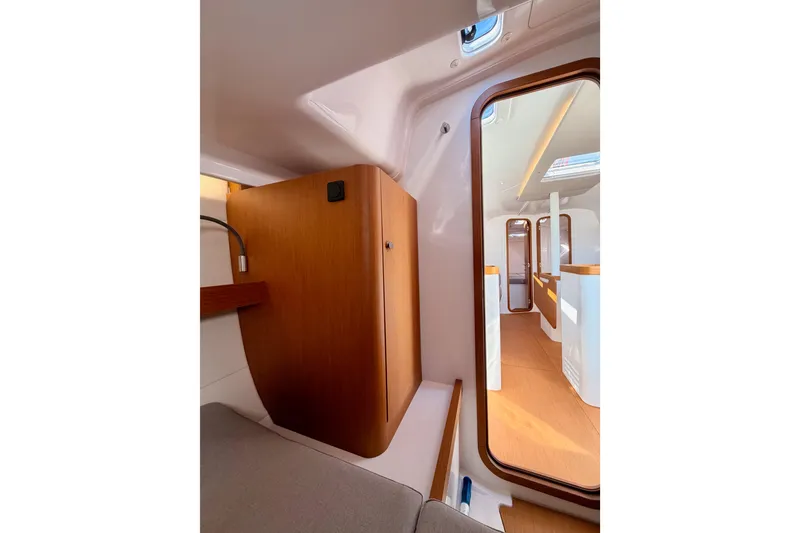 Slide: The Image of Interior of 2023 Beneteau First 36 sailboat, featuring modern wood finishes and sleek design. - 66