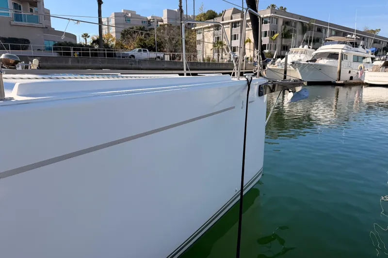 Slide: The Image of 2023 Beneteau First 36 sailboat docked in a marina, showcasing sleek design. - 7