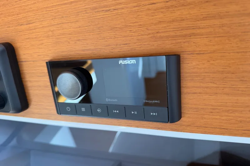 Slide: The Image of Fusion audio system on 2023 Beneteau First 36 yacht, mounted on wooden panel. - 73