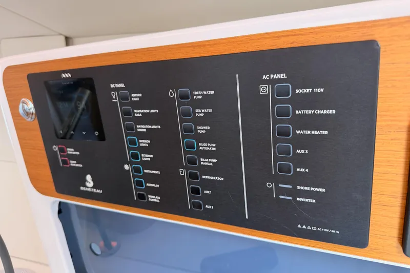 Slide: The Image of Control panel of 2023 Beneteau First 36 yacht, featuring DC and AC systems. - 75