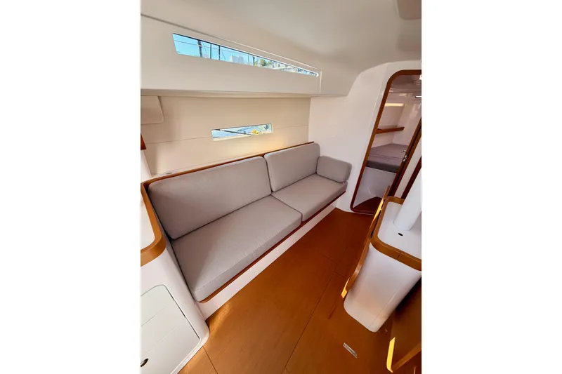 Slide: The Image of Interior of 2023 Beneteau First 36 yacht, featuring sleek design and comfortable seating. - 78