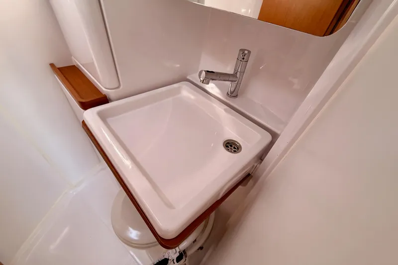 Slide: The Image of Modern bathroom sink in 2023 Beneteau First 36 yacht, featuring sleek design and wood accents. - 83