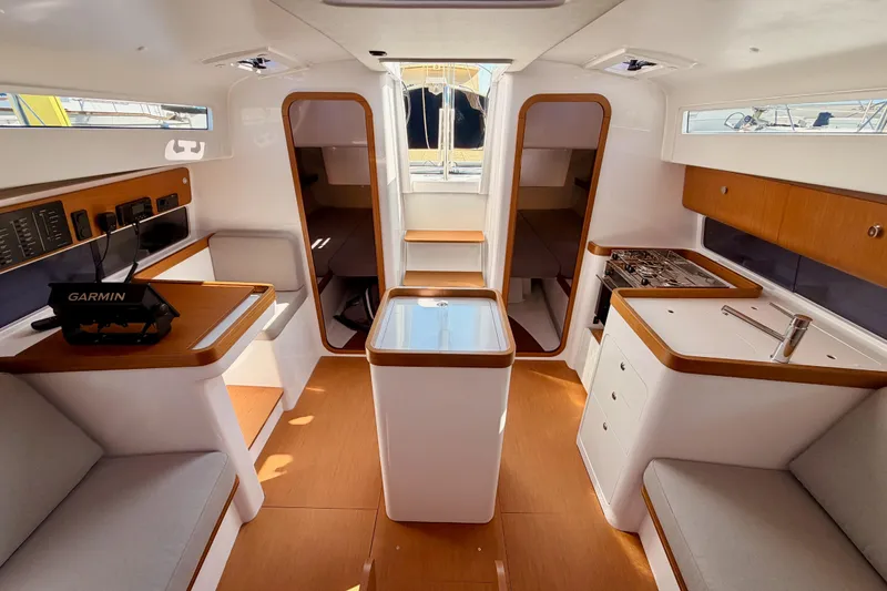 Slide: The Image of Interior of 2023 Beneteau First 36 sailboat, featuring modern design and navigation equipment. - 93