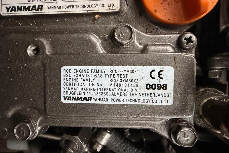 Slide: The Image of Yanmar engine label on a 2023 Beneteau First 36 sailboat, showing certification details. - 97