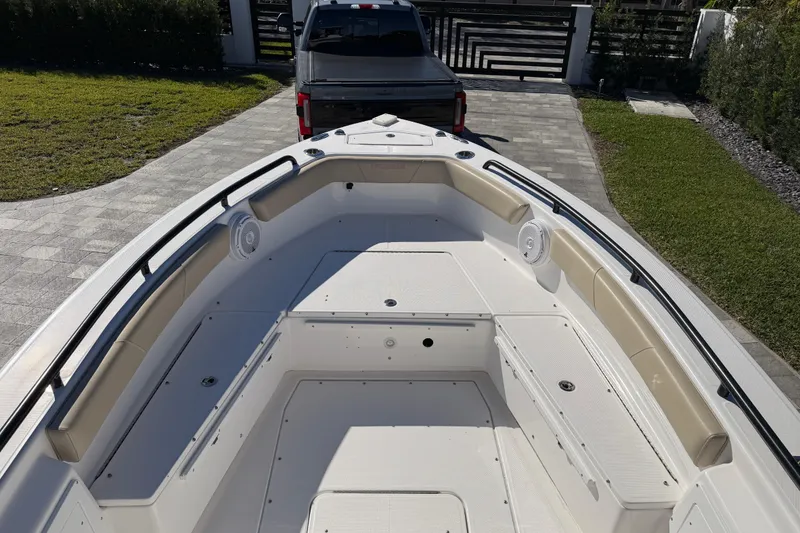 Slide: The Image of 2019 Everglades 243 Center Console boat on driveway, viewed from bow. - 10