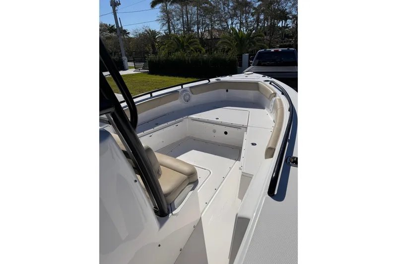 Slide: The Image of 2019 Everglades 243 Center Console boat interior with seating and storage compartments. - 9