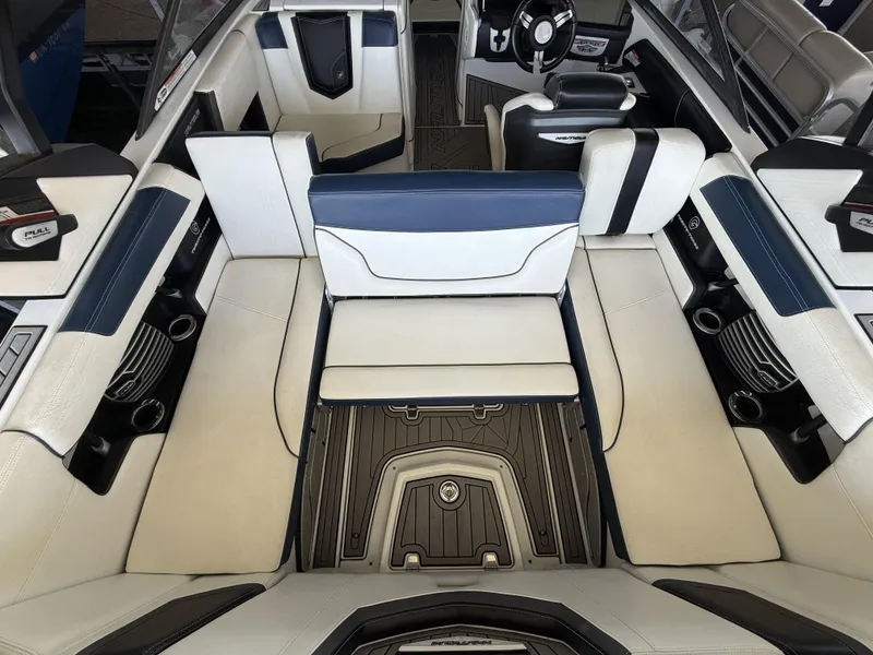 Slide: The Image of Interior of a 2018 Nautique G23 boat with luxurious seating. - 20