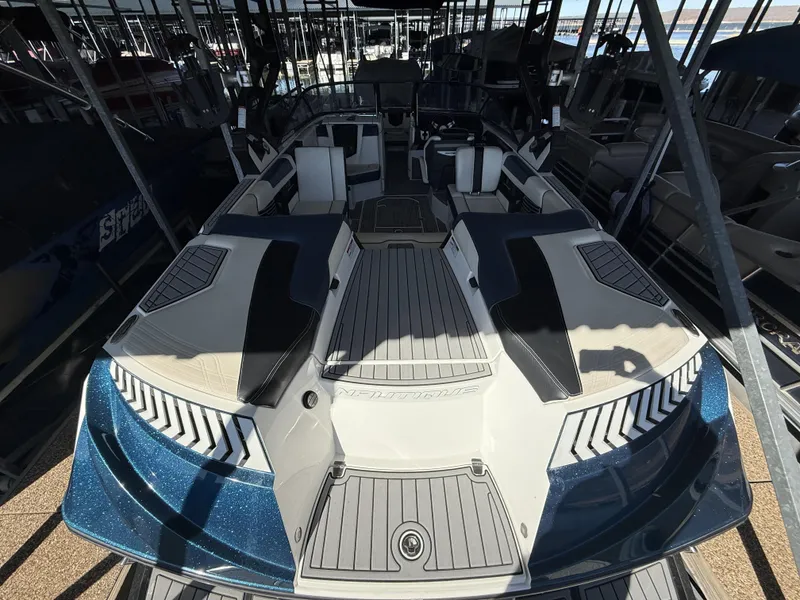 Slide: The Image of 2018 Nautique G23 boat in dock, modern design. - 6