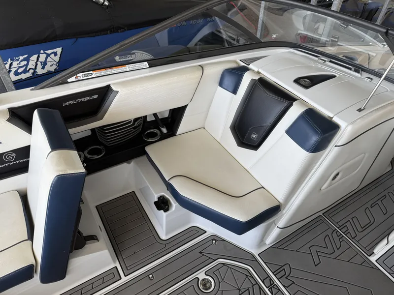 Slide: The Image of Interior of a 2018 Nautique G23 boat with luxurious seating. - 8