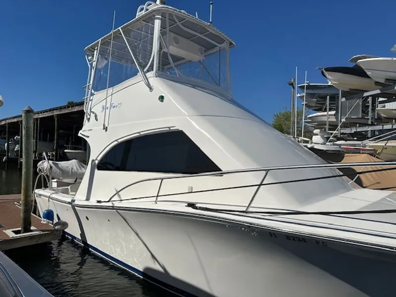 Slide: The Image of 2005 Luhrs 33 Convertible yacht docked at marina. - 37
