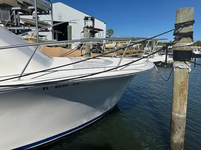 Slide: The Image of 2005 Luhrs 33 Convertible docked at marina. - 38