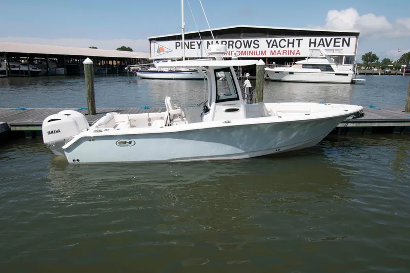 Slide: The Image of 2023 Sea Hunt Ultra 265 SE boat docked at Piney Narrows Yacht Haven marina. - 1