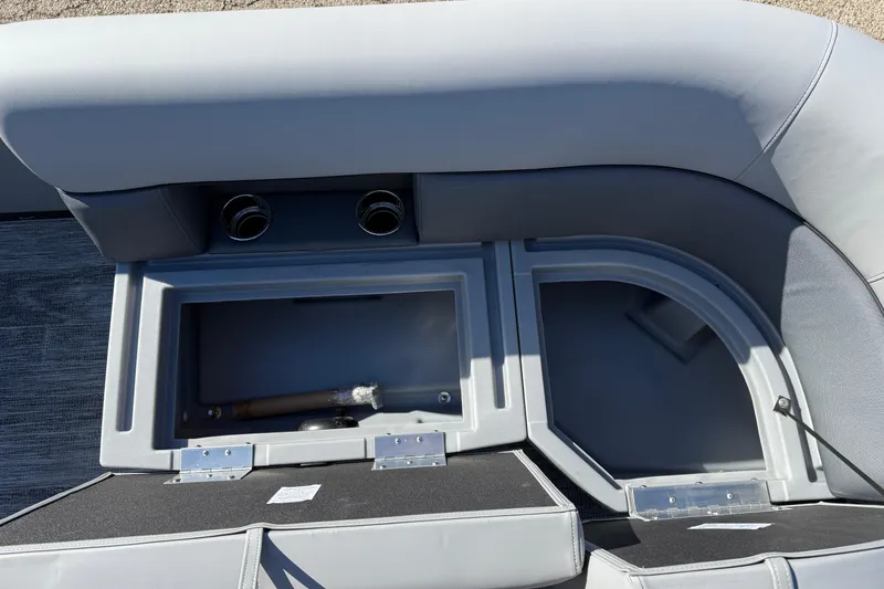 Slide: The Image of 2026 Bentley Pontoons Legacy 200 Cruise XL interior storage compartment with cup holders. - 13