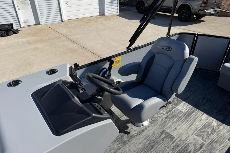 Slide: The Image of 2026 Bentley Pontoons Legacy 200 Cruise XL helm with gray captain's chair and steering wheel. - 15