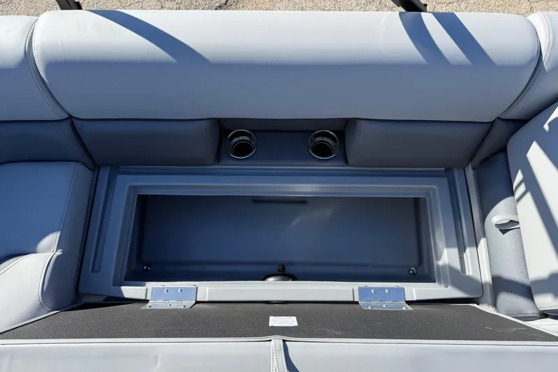 Slide: The Image of 2026 Bentley Pontoons Legacy 200 Cruise XL seating with storage compartment and cup holders. - 21