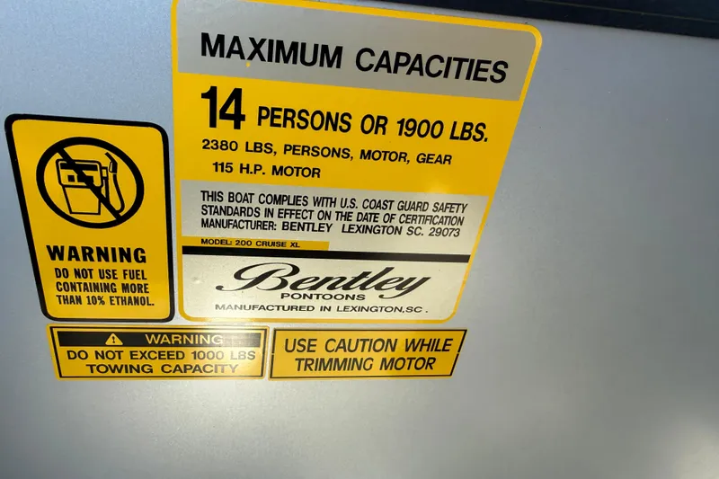 Slide: The Image of 2026 Bentley Pontoons Legacy 200 Cruise XL capacity and safety warning labels. - 23