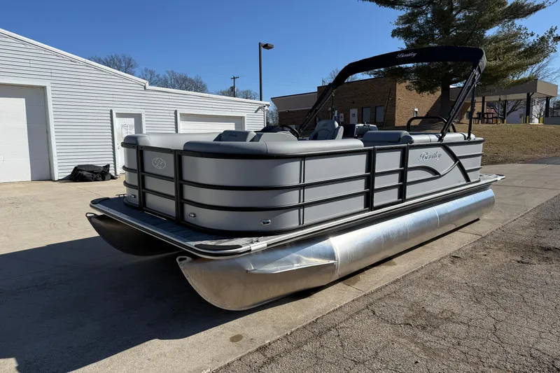 Slide: The Image of 2026 Bentley Pontoons Legacy 200 Cruise XL pontoon boat parked outdoors. - 3