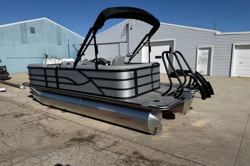 Slide: The Image of 2026 Bentley Pontoons Legacy 200 Cruise XL pontoon boat parked outdoors. - 5