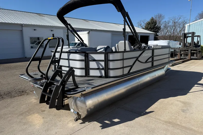 Slide: The Image of 2026 Bentley Pontoons Legacy 200 Cruise XL pontoon boat parked outdoors. - 7