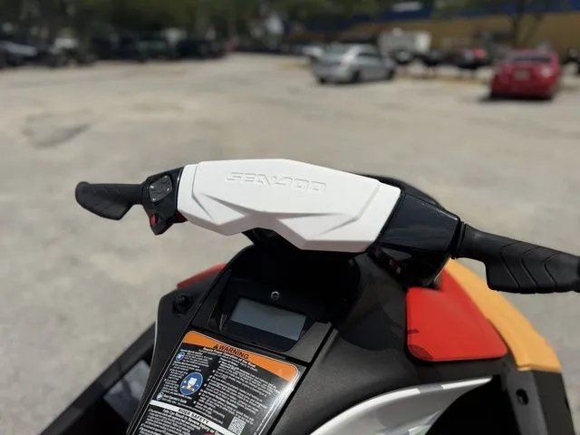 Slide: The Image of Handlebars of a 2026 Sea-Doo Spark for 2 on a parking lot. - 10