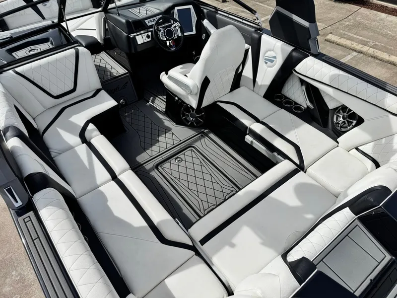 Slide: The Image of Interior of a 2018 Tigé 23RZX boat with luxurious seating. - 11