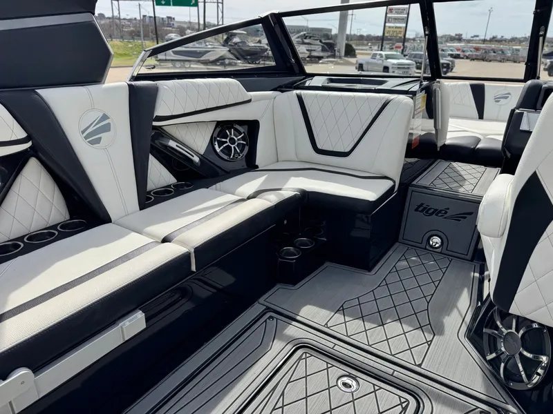Slide: The Image of Interior of a 2018 Tigé 23RZX boat with luxurious seating. - 12