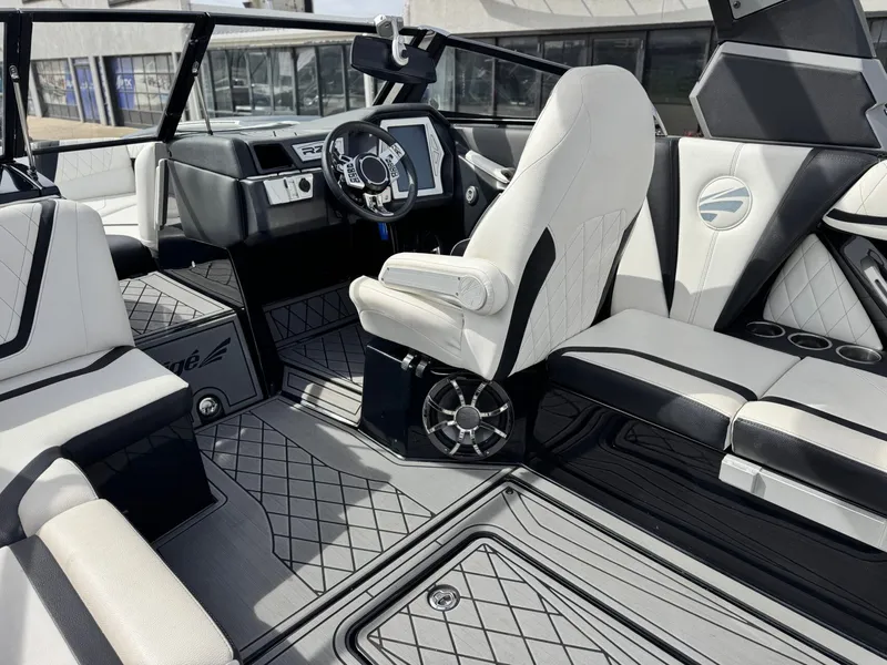 Slide: The Image of Interior of a 2018 Tigé 23RZX boat with luxurious features. - 13