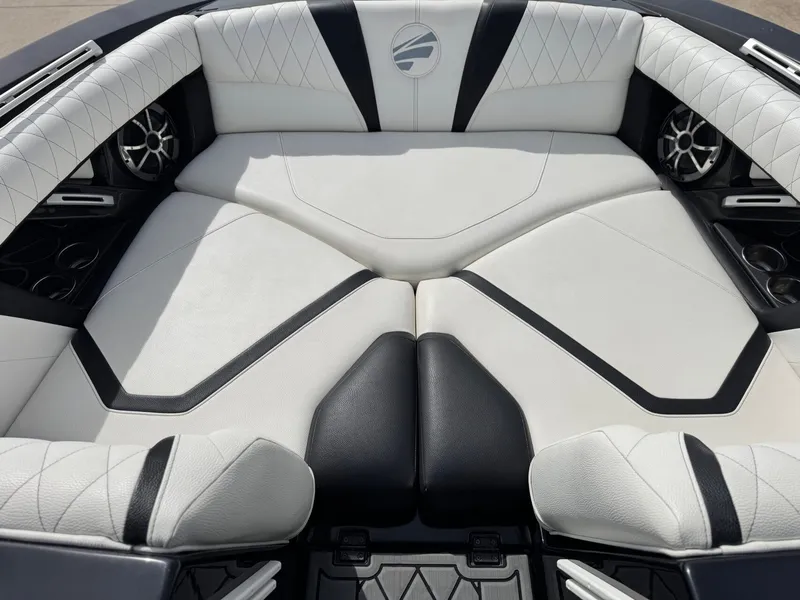 Slide: The Image of Interior of a 2018 Tigé 23RZX boat with luxurious upholstery. - 16