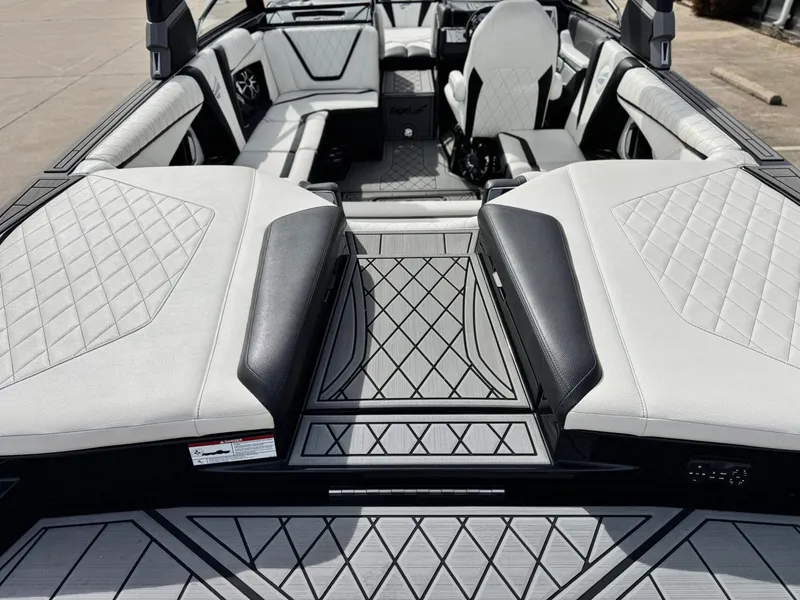Slide: The Image of Interior of a 2018 Tigé 23RZX boat with luxurious upholstery. - 8