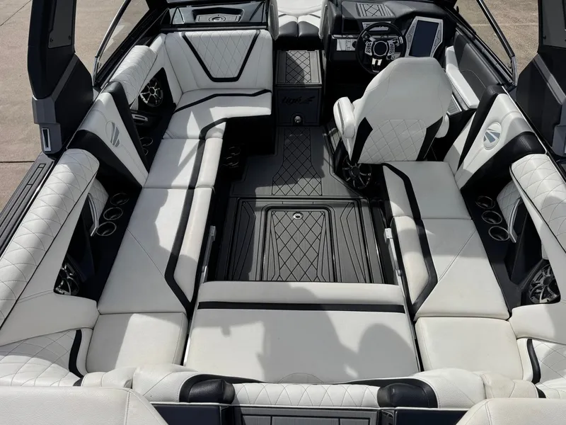 Slide: The Image of Interior of a 2018 Tigé 23RZX boat with luxurious upholstery. - 9