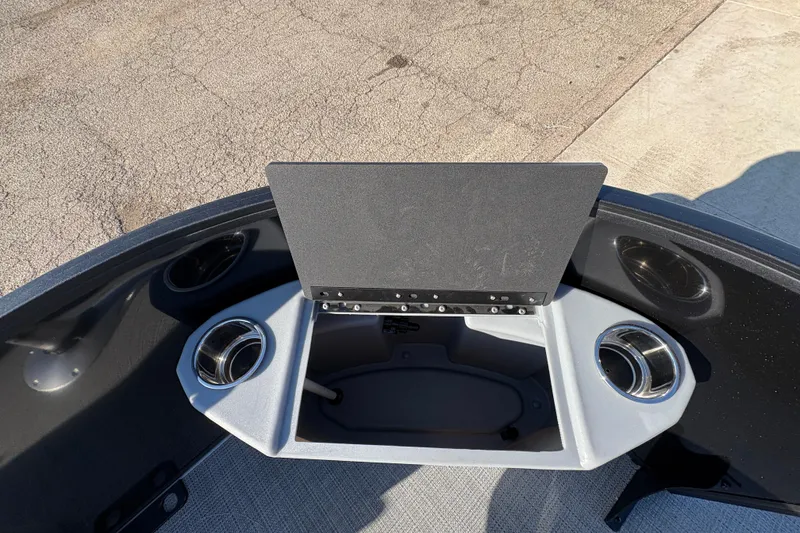 Slide: The Image of 2026 Bentley Pontoons Fish 220 FWD CW boat interior with cup holders and storage compartment. - 11
