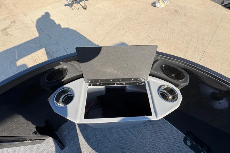 Slide: The Image of 2026 Bentley Pontoons Fish 220 FWD CW console with cup holders and storage compartment. - 13