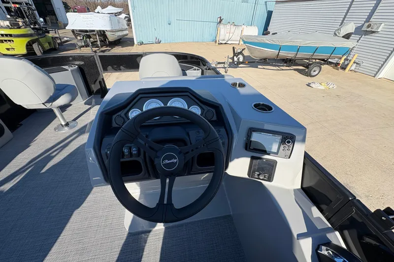 Slide: The Image of 2026 Bentley Pontoons Fish 220 FWD CW dashboard with steering wheel and controls. - 19