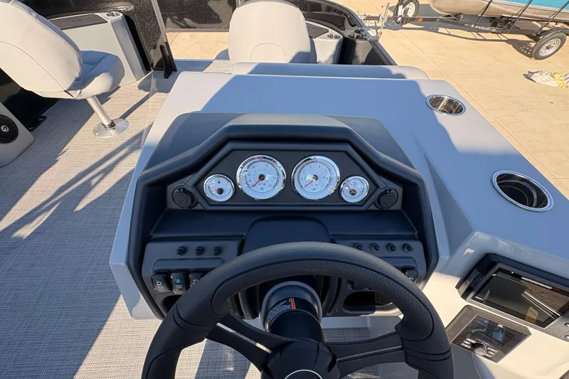 Slide: The Image of 2026 Bentley Pontoons Fish 220 FWD CW dashboard with steering wheel and gauges. - 20